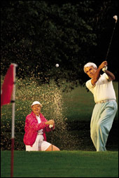 (image of golfing couple)